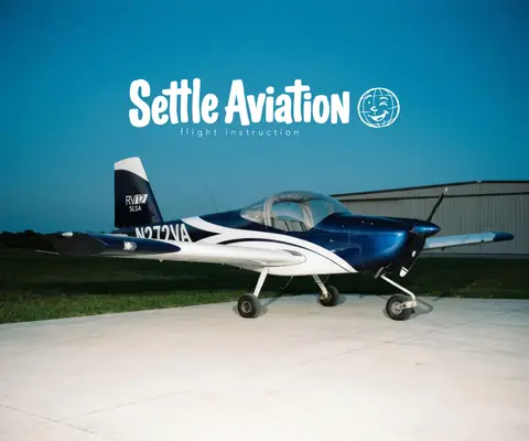 N272VA, a blue and white Van's RV-12 ULS, beneath the Settle Aviation name